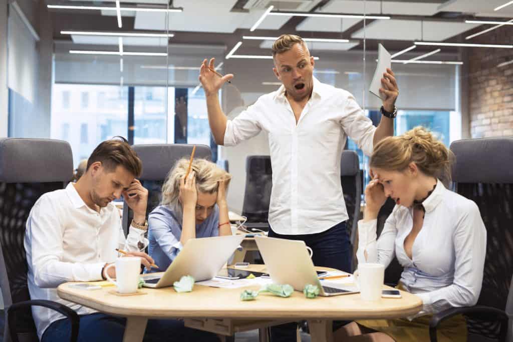 Angry boss yelling at team