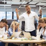 Angry boss yelling at team